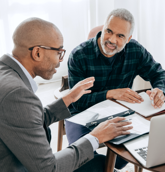 lawyer and client talking on a desk