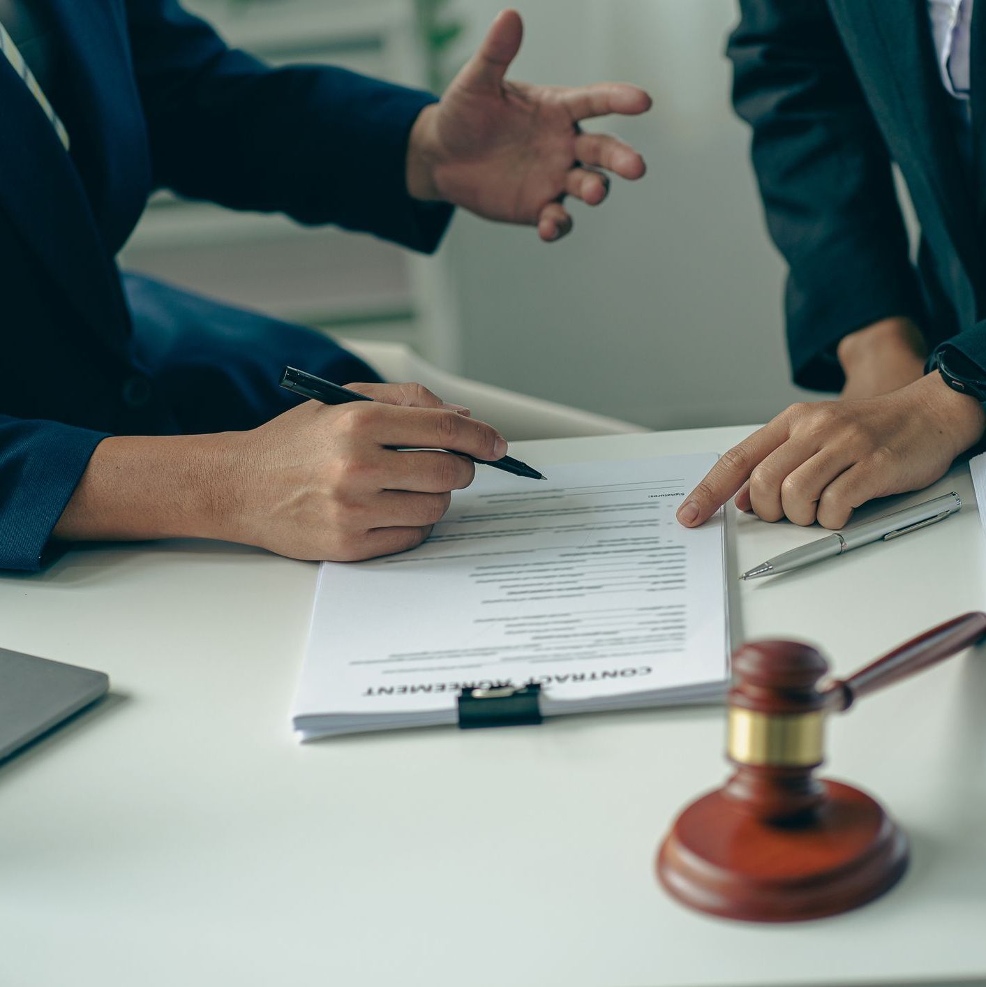 A meeting of professional business women and male lawyers working