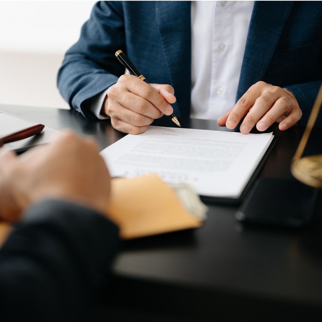 lawyer desk with documents and client